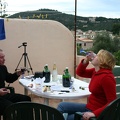 Micha and Katie enjoyng food and wine on the balcony.