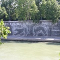Large graffiti depicting the she-wolf which raised Remulus and Romus along the banks of the Tiber