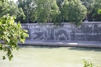 Large graffiti depicting the she-wolf which raised Remulus and Romus along the banks of the Tiber