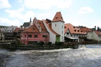 An old mill (now restaurant) being battered by the Vltava river