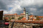 Juinor with an imposing backdrop of ?eský Krumlov and the castle