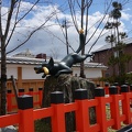 Fox statue in front of Fushimi Inari-taisha Shrine.