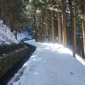 The path is icy, ditch on one side and cliff on the other.