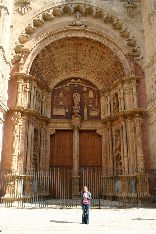 Olga dwarfed by the cathedral doors